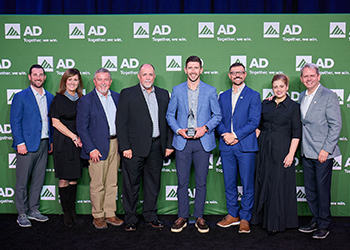 group of AD and State Electric members receiving the AD award